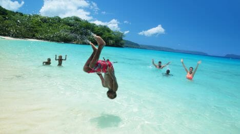 person-doing-a-flip-at-vanuatu-beach