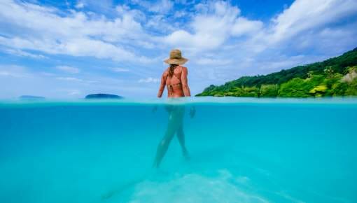 Lady swimming at Champagne Beach Vanuatu
